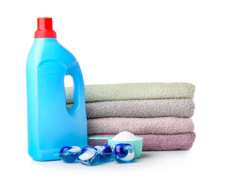 Towels and laundry detergents on white backgroundの写真素材