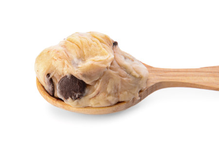 Spoon with sweet dough on white backgroundの写真素材