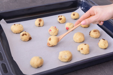 Woman preparing sweet cookies for baking