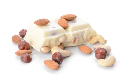 Sweet tasty chocolate with nuts on white backgroundの写真素材