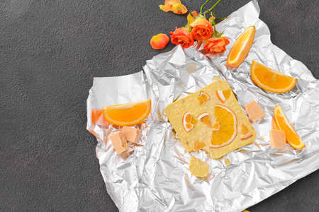 Sweet white chocolate with orange on tableの写真素材