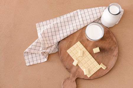 Sweet white chocolate and milk on tableの写真素材