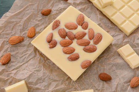 Sweet white chocolate with almond on tableの写真素材