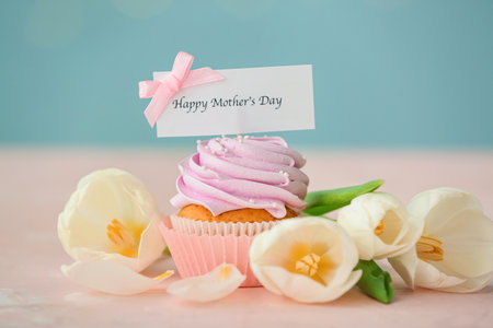 Tasty cupcake for Mother's Day on tableの写真素材