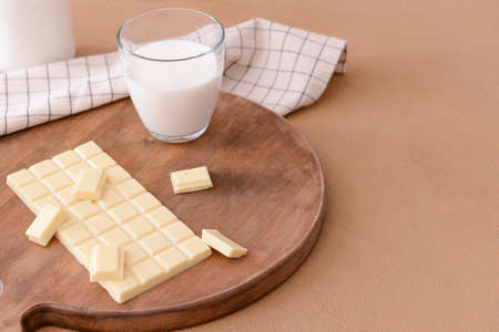 Sweet white chocolate and milk on tableの写真素材