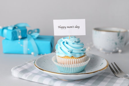 Tasty cupcake for Mother's Day on tableの写真素材