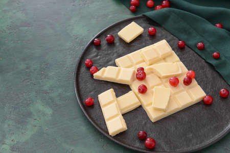 Sweet white chocolate with cranberry on tableの写真素材