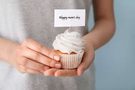 Woman with tasty cupcakes for Mother's Day, closeupの写真素材