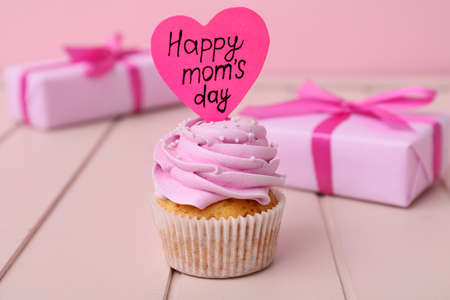 Tasty cupcake for Mother's Day on tableの写真素材