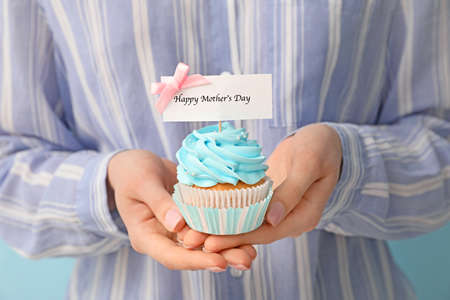 Woman with tasty cupcakes for Mother's Day, closeupの写真素材