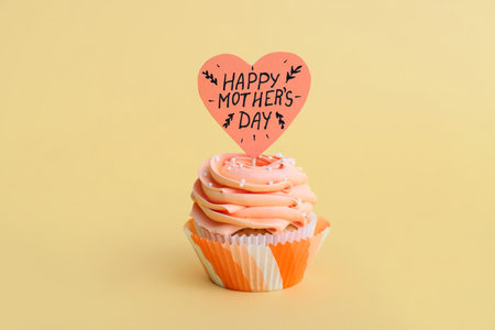 Tasty cupcake for Mother's Day on color backgroundの写真素材