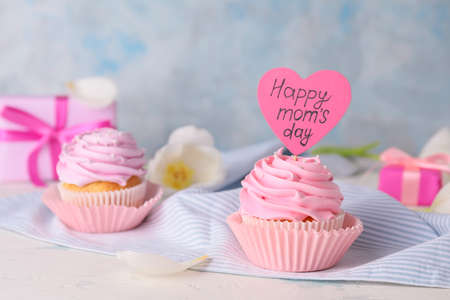 Tasty cupcake for Mother's Day on tableの写真素材