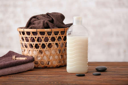 Laundry detergent with towels on tableの写真素材