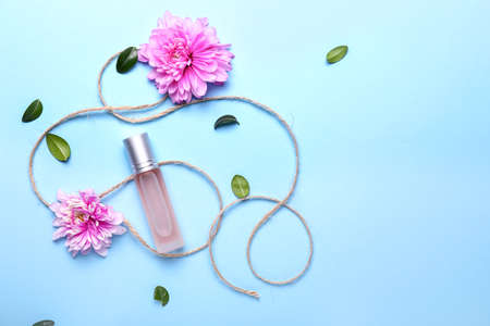 Beautiful composition with perfume bottle on color backgroundの写真素材