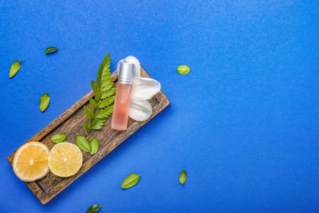 Beautiful composition with perfume bottle on color backgroundの写真素材