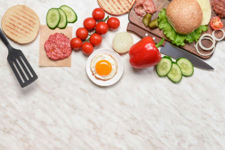 Ingredients for tasty burger on white backgroundの写真素材