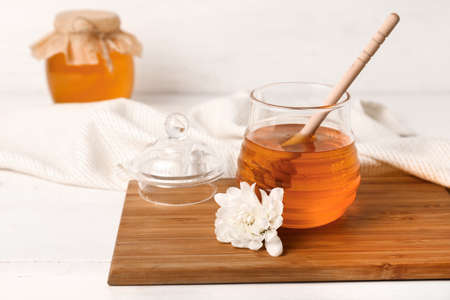Jar of sweet honey on tableの写真素材