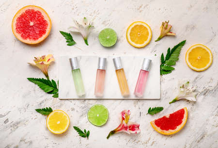 Beautiful composition with perfume bottles on white backgroundの写真素材