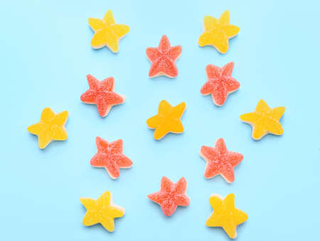 Sweet jelly candies on color backgroundの写真素材