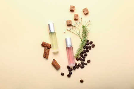 Beautiful composition with perfume bottles on color backgroundの写真素材