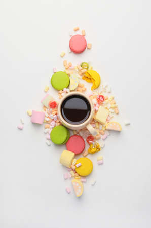 Sweets with cup of coffee on white backgroundの写真素材