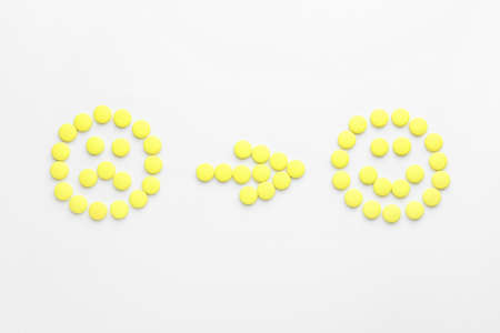 Creative composition with pills on white background