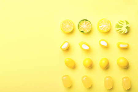 Assortment of sweet candies on color backgroundの写真素材