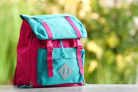 School backpack on table outdoorsの写真素材