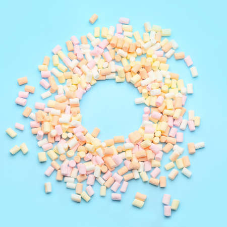Frame made of marshmallows on color backgroundの写真素材