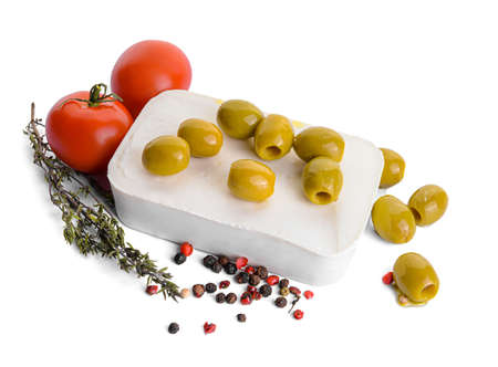 Tasty feta cheese, olives and spices on white backgroundの写真素材
