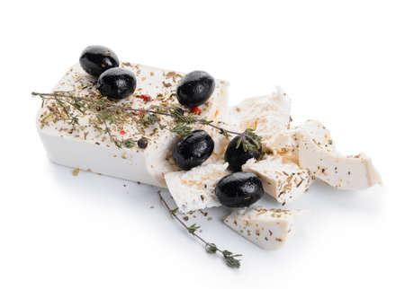 Tasty feta cheese, olives and spices on white backgroundの写真素材