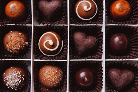 Box with delicious chocolate candies, closeupの写真素材