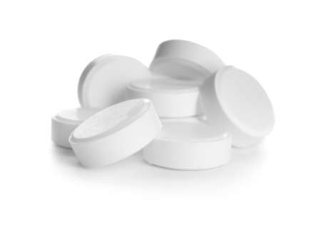 Heap of pills on white background