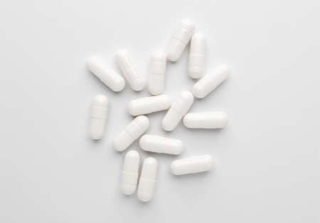 Heap of pills on white backgroundの写真素材