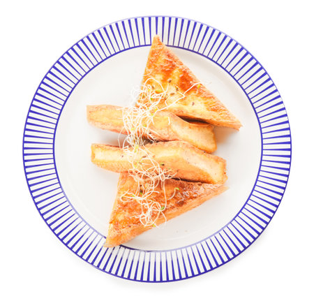 Plate with tasty tofu cheese on white backgroundの写真素材