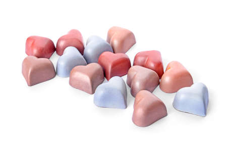 Assortment of delicious candies on white background