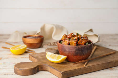 Bowl with tasty tofu cheese on tableの写真素材