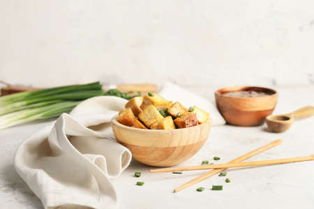 Bowl with tasty tofu cheese on white backgroundの写真素材