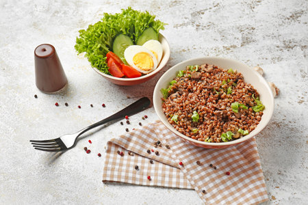 Plate with tasty buckwheat on white backgroundの写真素材