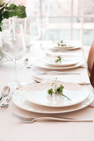 Beautiful table setting in dining roomの写真素材