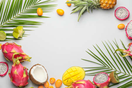 Frame made of different exotic fruits on gray backgroundの写真素材