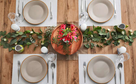 Beautiful table setting on wooden backgroundの写真素材