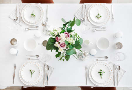 Beautiful table setting in dining roomの写真素材