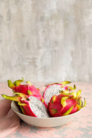 Plate with tasty dragon fruit on tableの写真素材