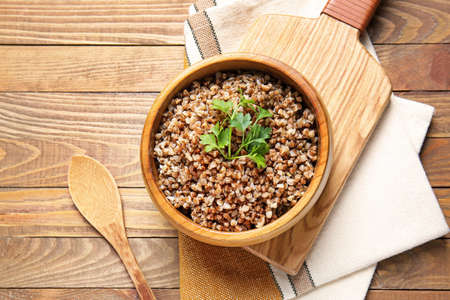 Bowl of tasty buckwheat porridge on tableの写真素材