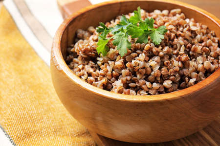 Bowl of tasty buckwheat porridge on table, closeupの写真素材