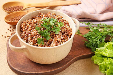 Pot of tasty buckwheat porridge on tableの写真素材