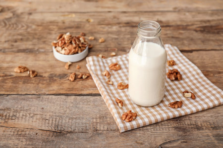 Bottle of tasty walnut milk on tableの写真素材