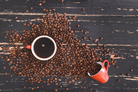 Composition with cup of hot coffee and beans on wooden backgroundの写真素材