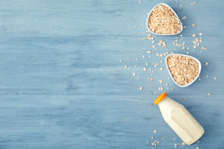 Bottle of tasty oat milk on tableの写真素材